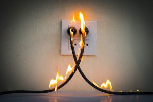 Burning power cords connected to the wall