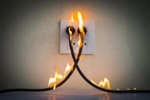 Burning power cords connected to the wall